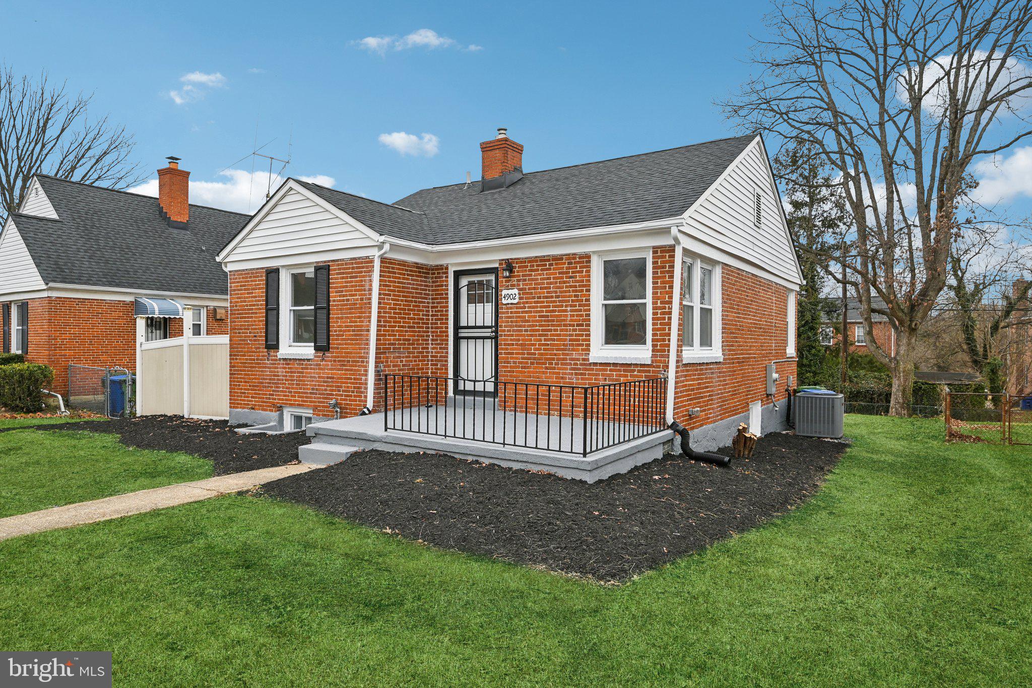 4902 Gilray Drive Baltimore, MD 21214 - Photo 49 of 54 a front view of a house with a yard