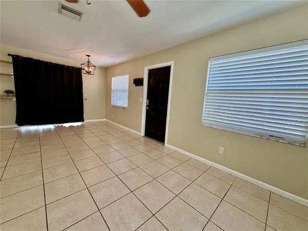 a view of an empty room with a window