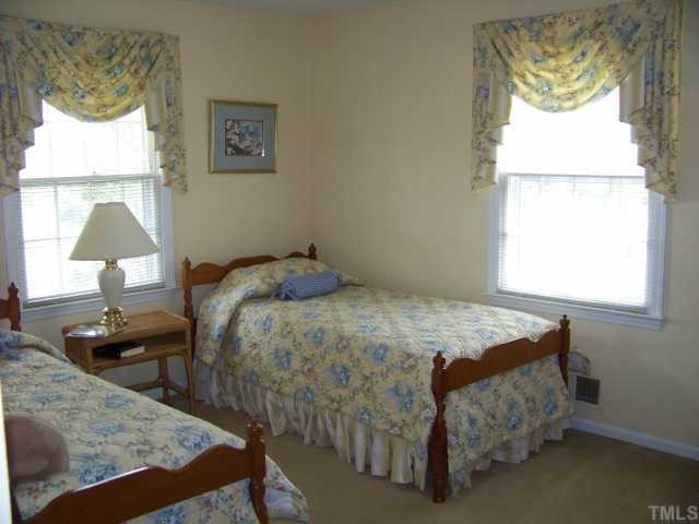 4210 Laurel Ridge Drive Raleigh, NC 27612 - Photo 10 of 12 This beautiful guest suite comfortably accommodates twin beds.