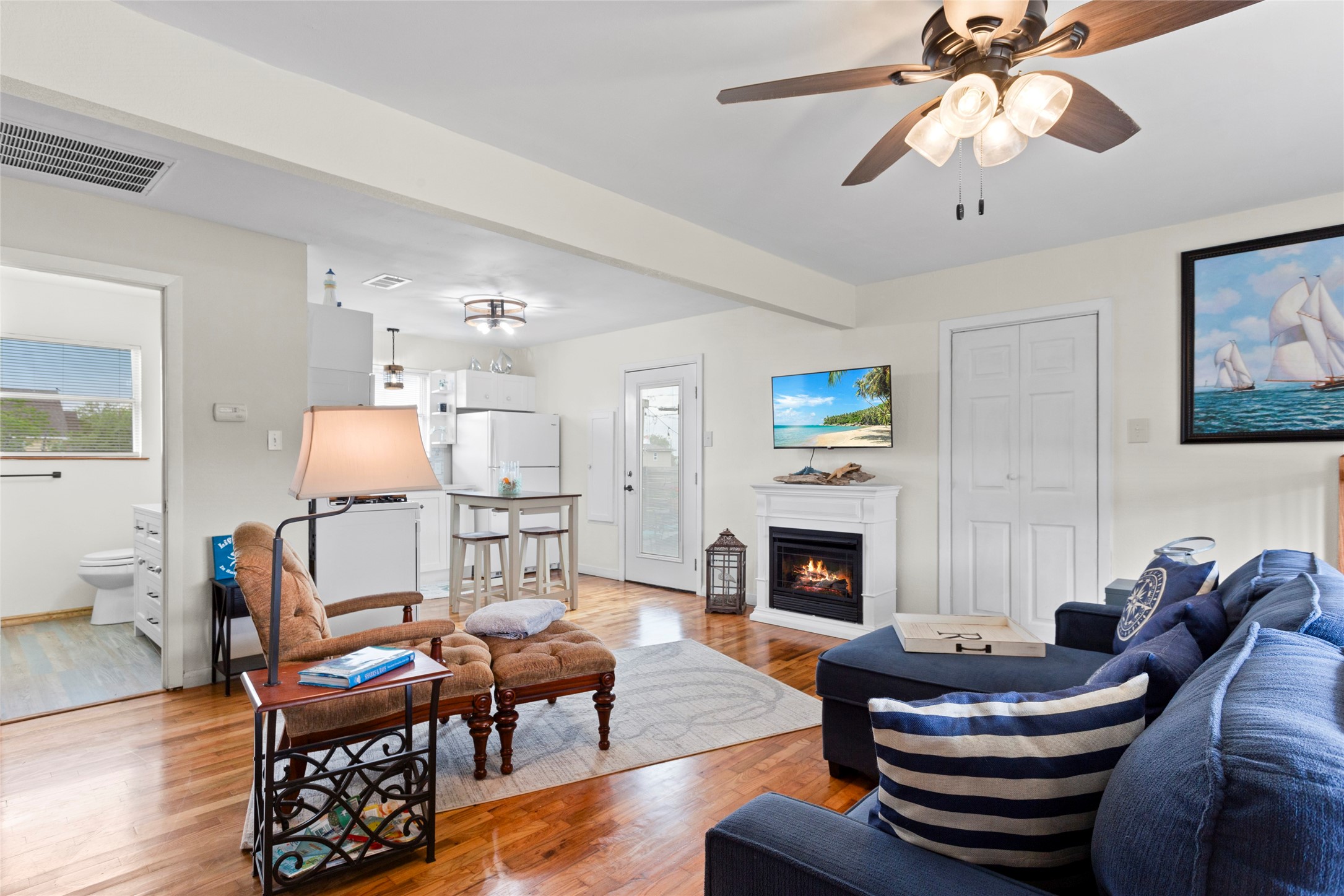 1619 FM 517 Road East San Leon, TX 77539 - Photo 12 of 27 This open layout offers a seamless transition to the kitchen and has a gas ventless fireplace in the living area.