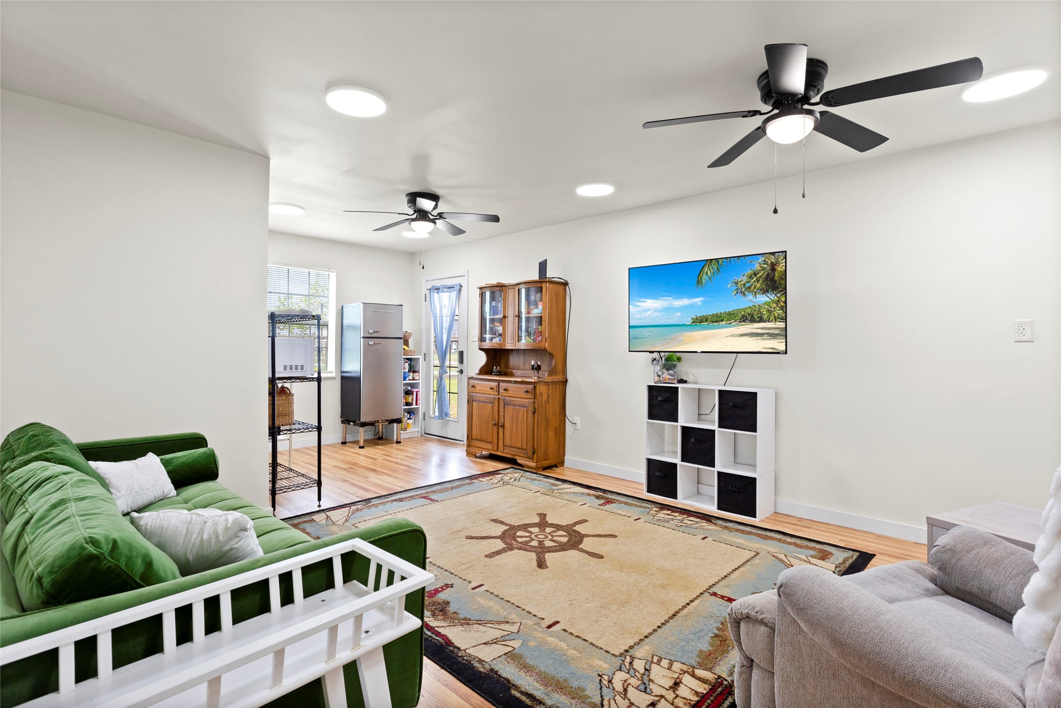 1619 FM 517 Road East San Leon, TX 77539 - Photo 8 of 27 Bright and cozy living space is well-lit with ceiling fans and recessed lighting.