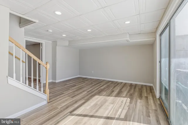 a view of hallway with wooden floor