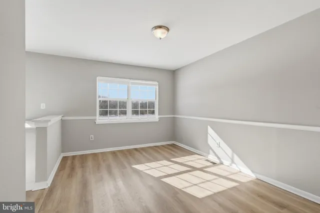 a view of wooden floor in an empty room