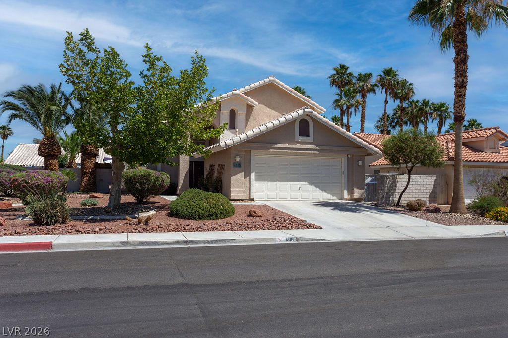 1416 Walstone Road North Las Vegas, NV 89031 - Photo 40 of 47 A desert oasis with verdant trees and mature palms frames this inviting residence.