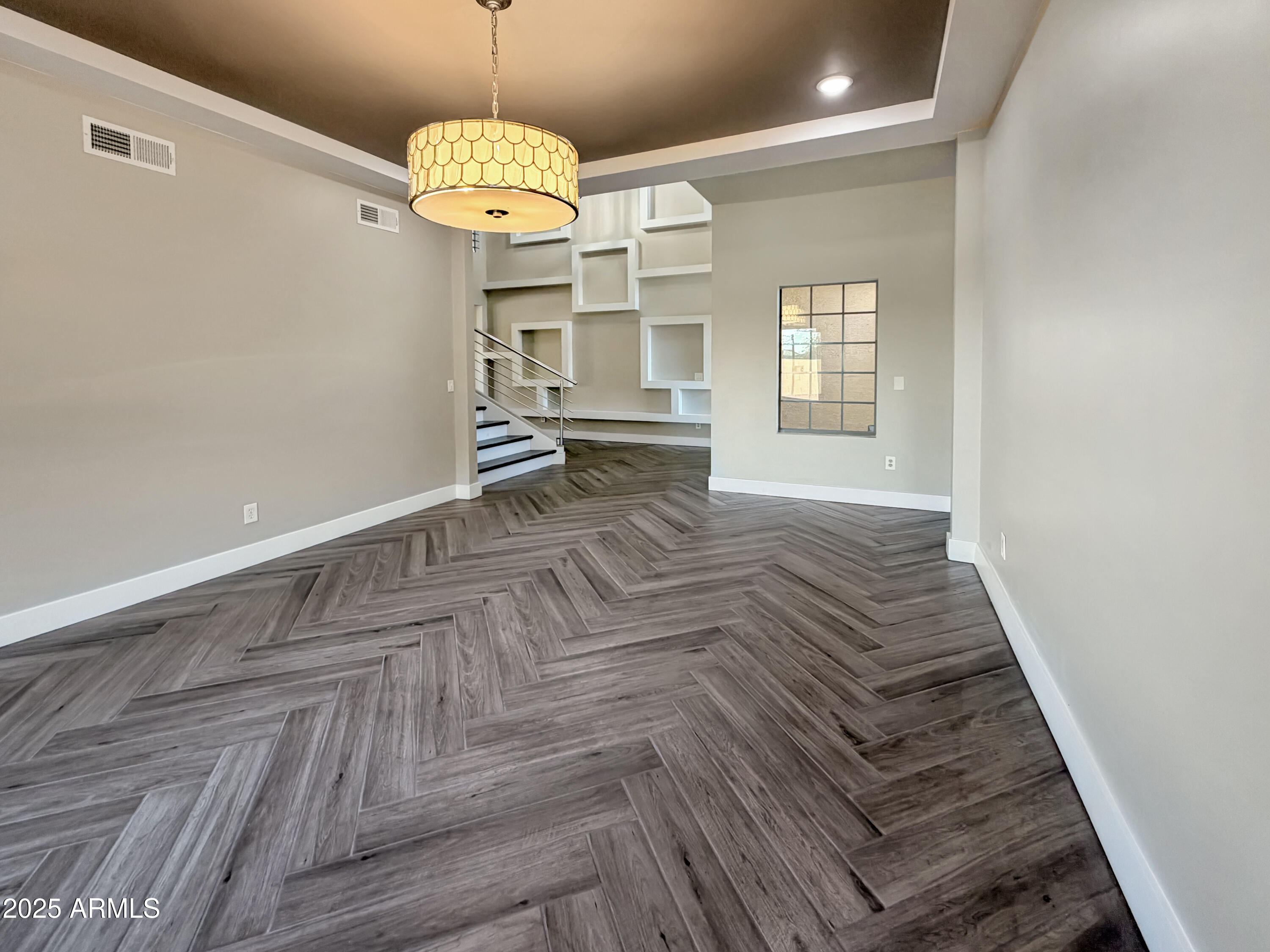 1712 East Joelle Drive Casa Grande, AZ 85122 - Photo 16 of 55 a view of a room with wooden floor and staircase