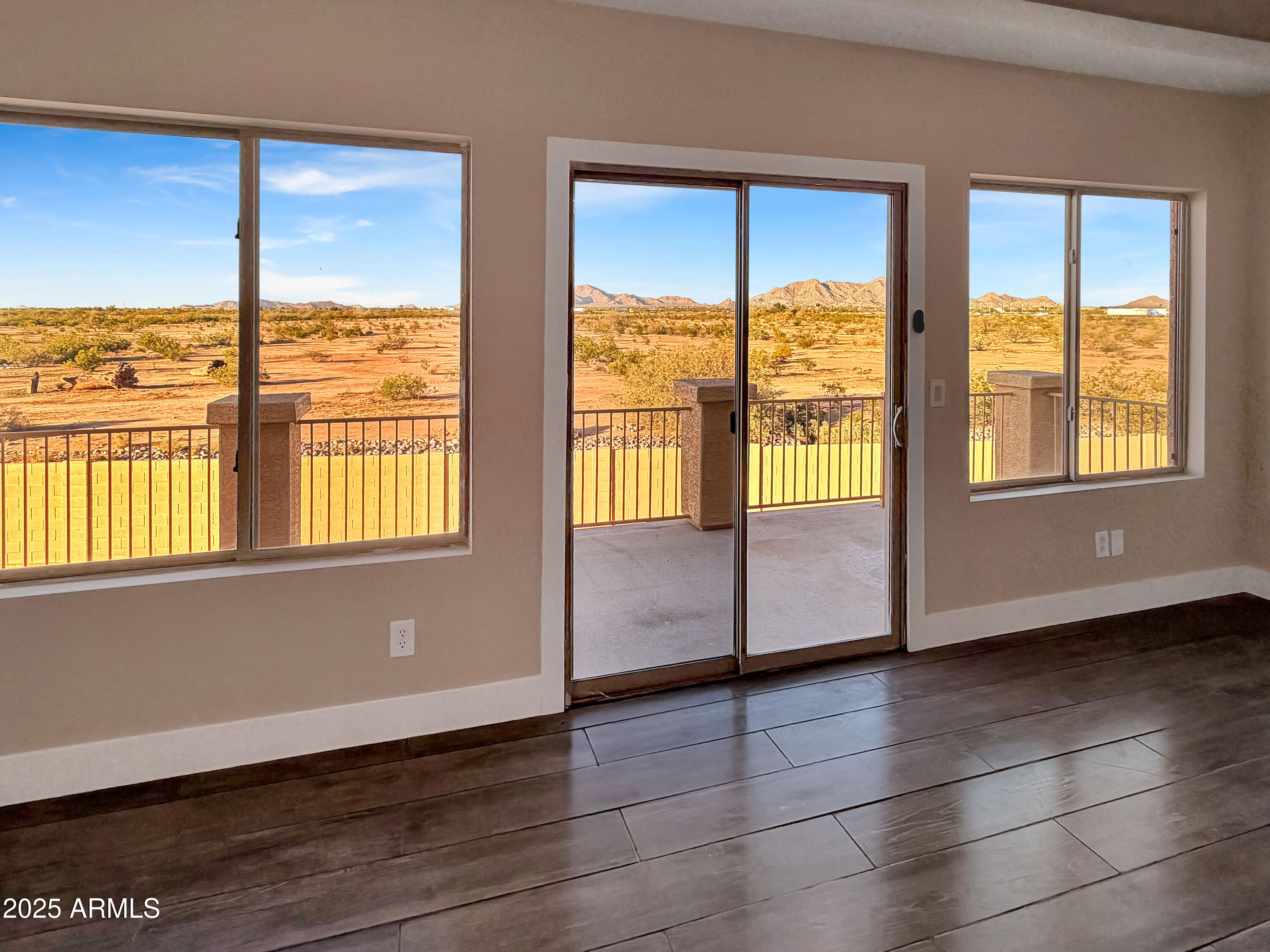1712 East Joelle Drive Casa Grande, AZ 85122 - Photo 20 of 55 an empty room with wooden floor and windows