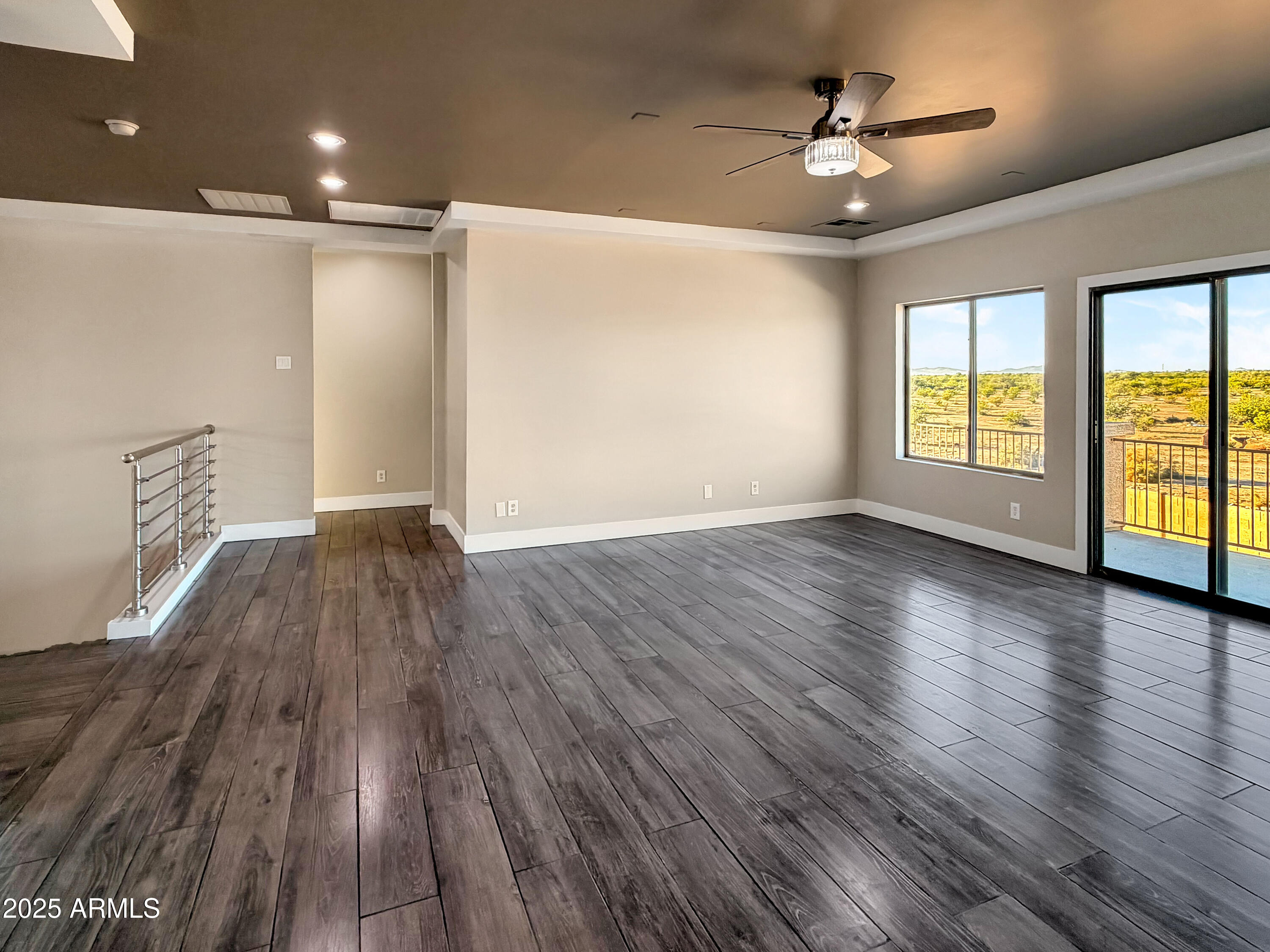 1712 East Joelle Drive Casa Grande, AZ 85122 - Photo 24 of 55 a view of empty room with wooden floor and fan