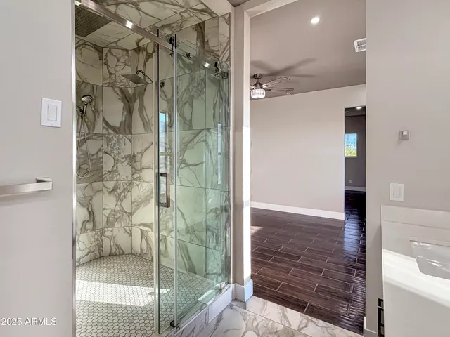 a bathroom with a sink double vanity and a mirror