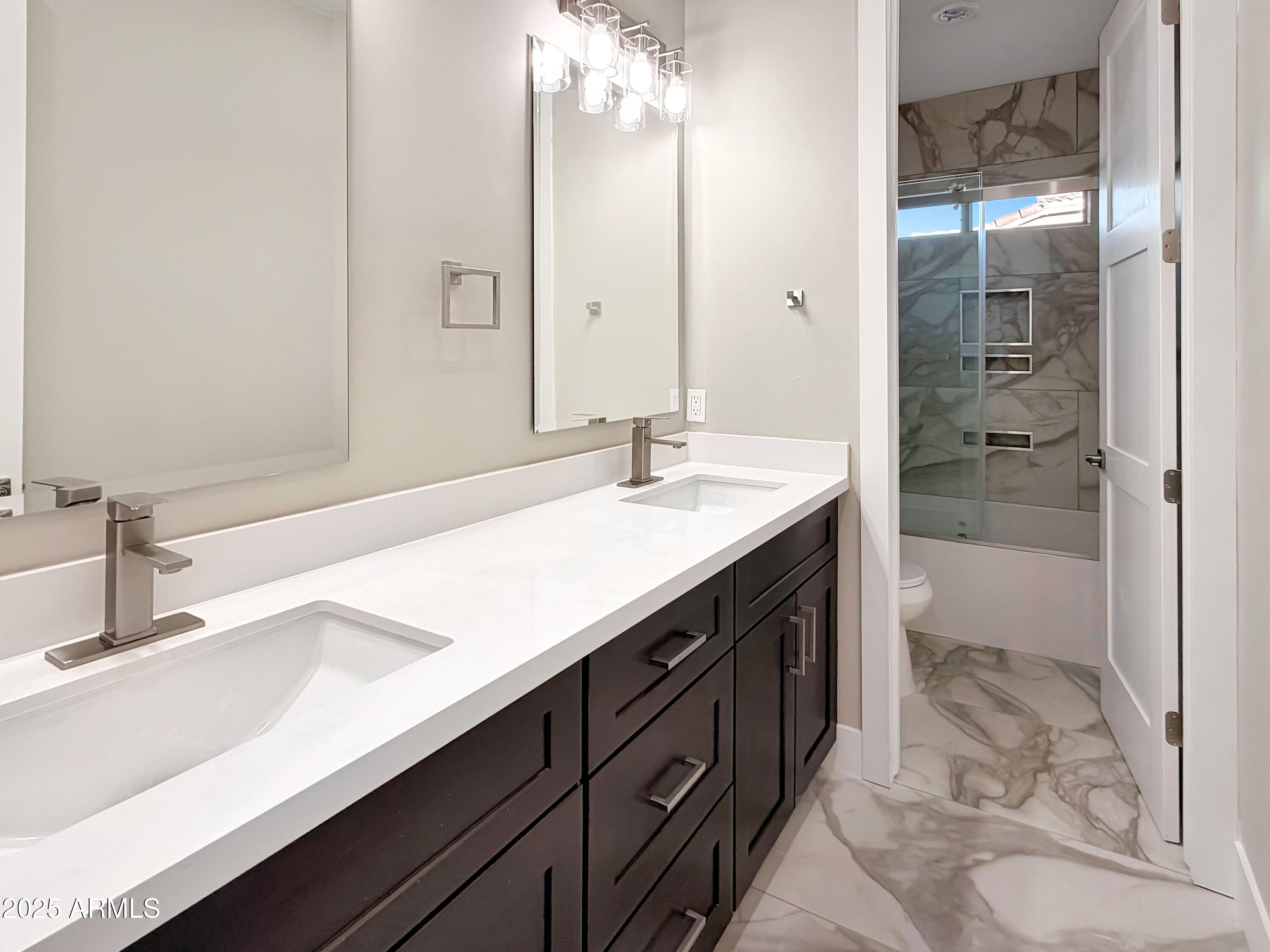 1712 East Joelle Drive Casa Grande, AZ 85122 - Photo 29 of 55 a bathroom with a sink double vanity and a shower