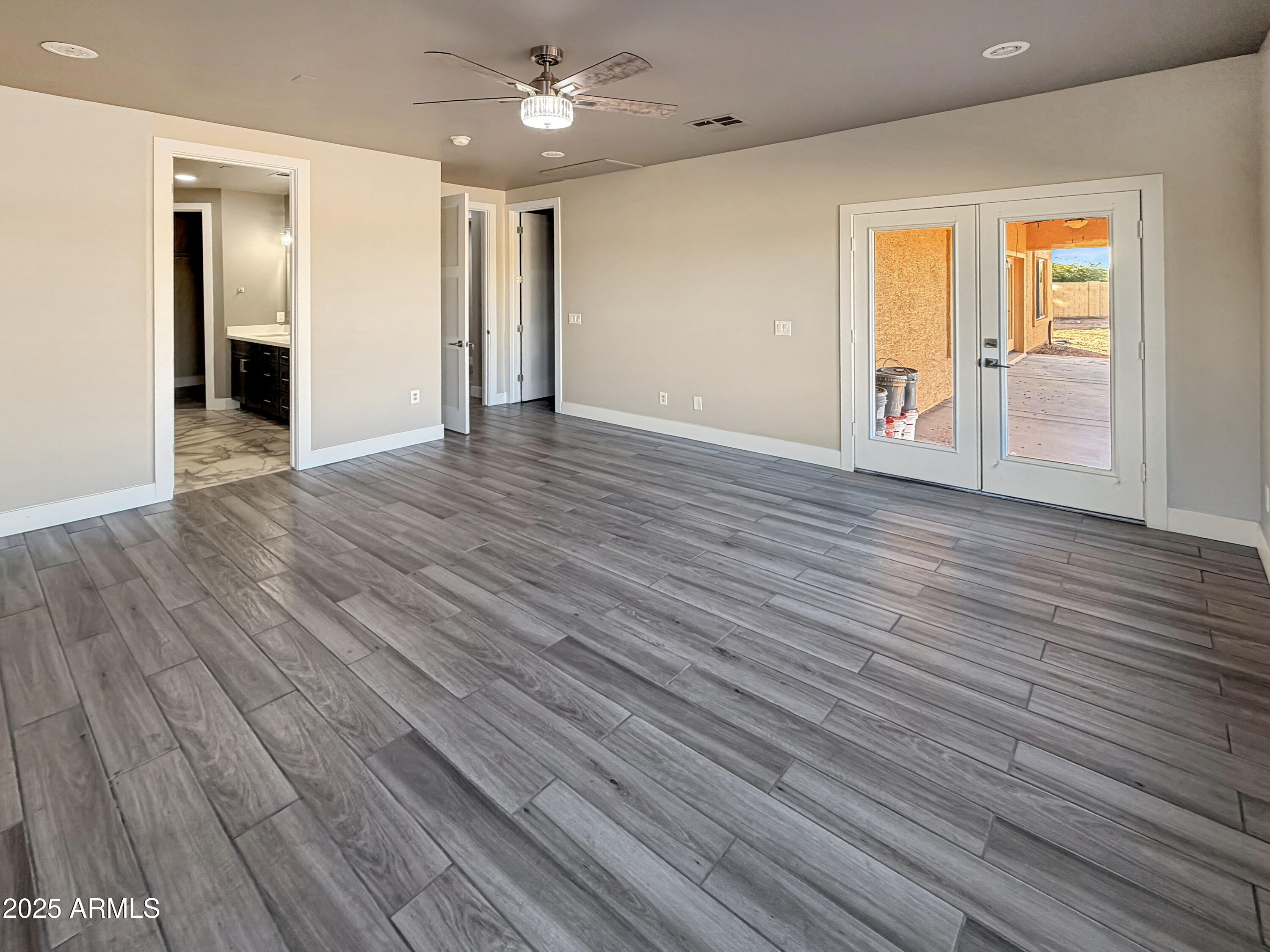 1712 East Joelle Drive Casa Grande, AZ 85122 - Photo 39 of 55 wooden floor in an empty room with a window