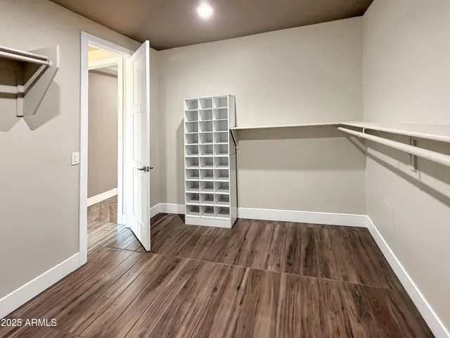 a bathroom with a toilet and a mirror