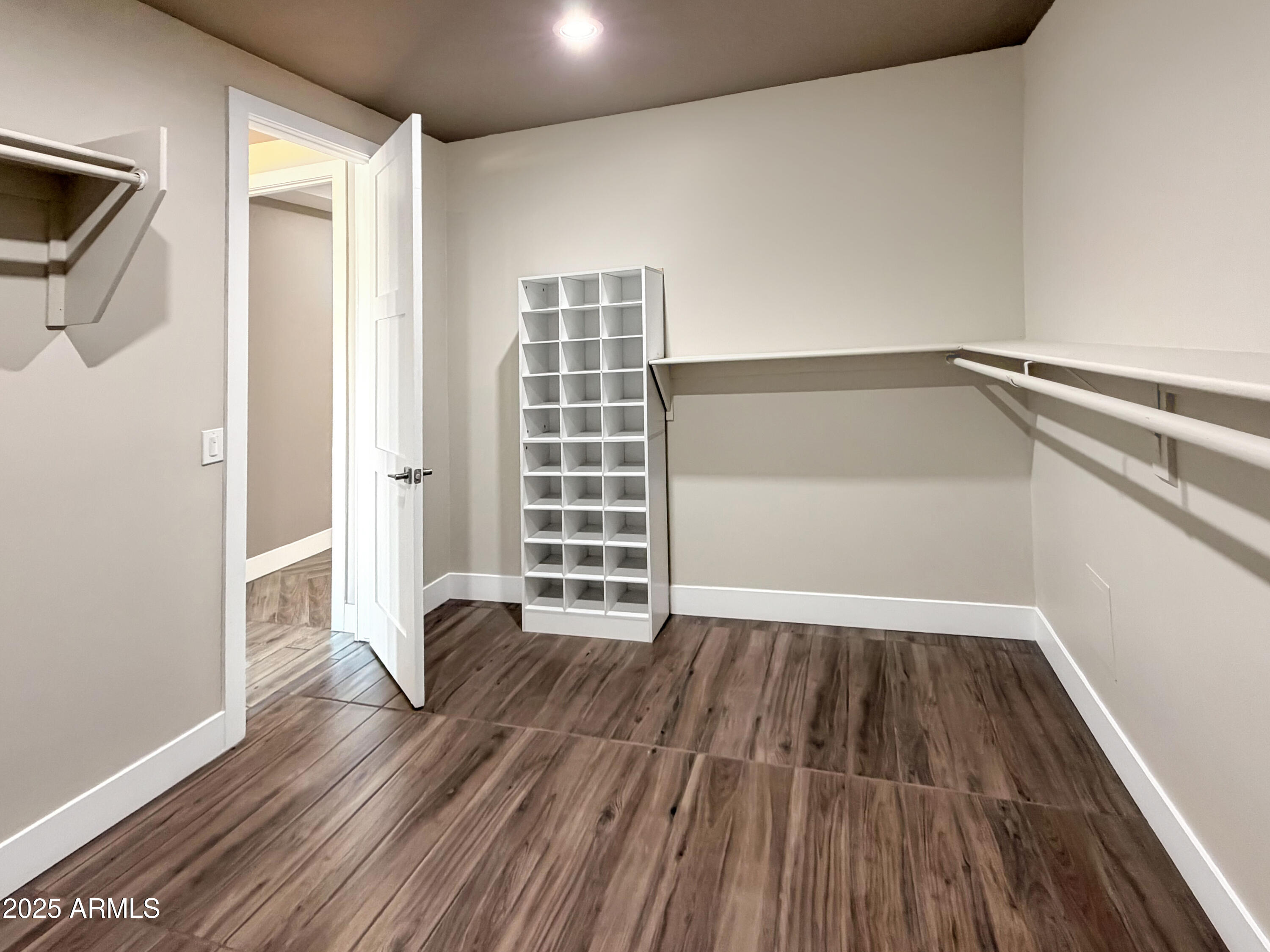 1712 East Joelle Drive Casa Grande, AZ 85122 - Photo 46 of 55 a view of an empty room with wooden floor and a window