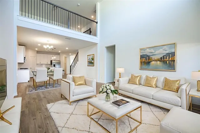 a view of kitchen and hall with wooden floor