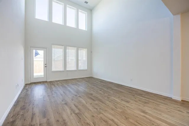 a bedroom with a bed and a potted plant