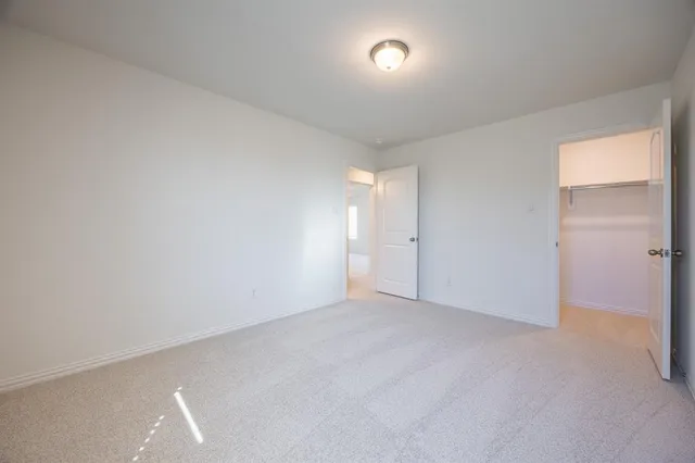 a view of a backyard with wooden fence