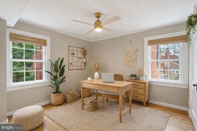 a workspace with furniture and window