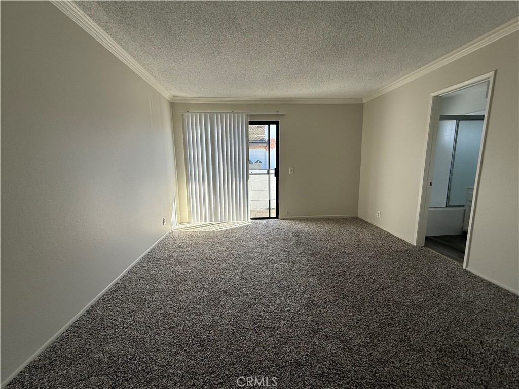 5250 Colodny Drive, Unit 17 Agoura Hills, CA 91301 - Photo 13 of 17 an empty room with windows and closet