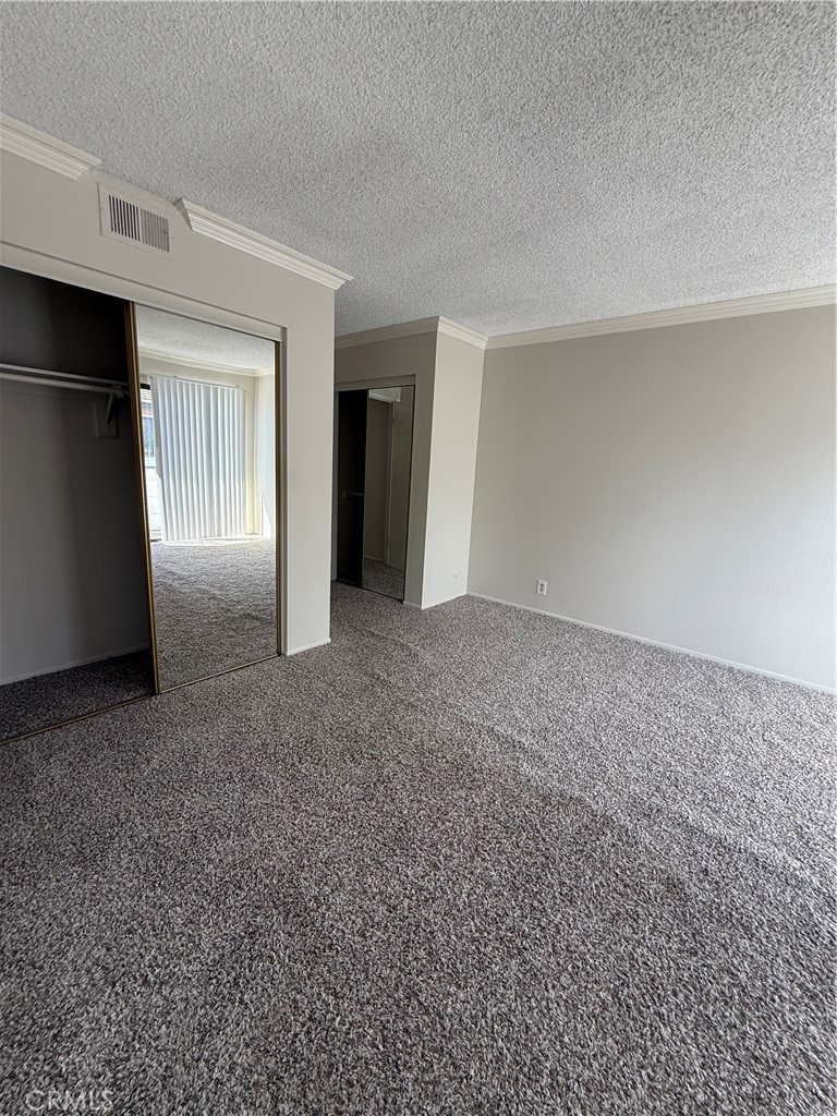 5250 Colodny Drive, Unit 17 Agoura Hills, CA 91301 - Photo 15 of 17 a view of an empty room with closet and a window
