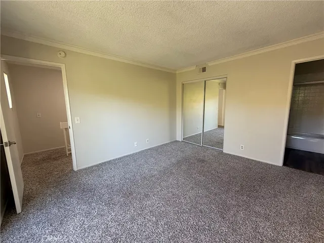 a bathroom with a shower a toilet and a sink