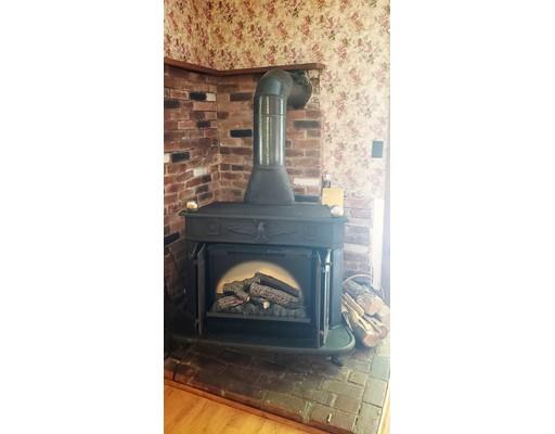 1590 Petersham Road Athol, MA 01331 - Photo 8 of 28 a living room with a fireplace
