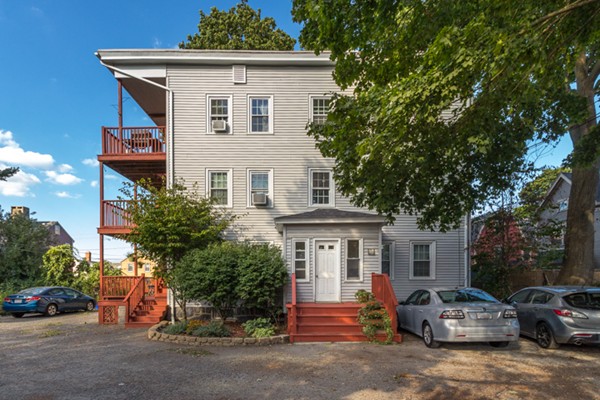 a front view of a house with a garage