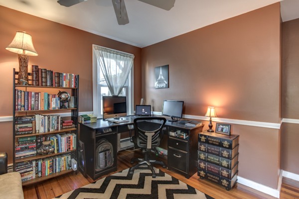 3 1/2 Becket Avenue, Unit 3 Salem, MA 01970 - Photo 15 of 22 a view of a workspace with furniture and a bookshelf