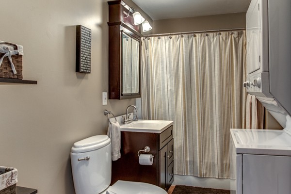 3 1/2 Becket Avenue, Unit 3 Salem, MA 01970 - Photo 18 of 22 a bathroom with a sink a toilet and mirror