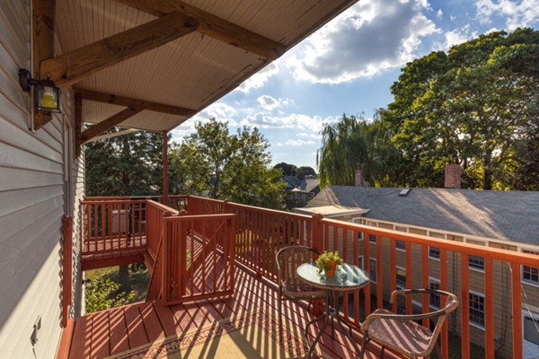 3 1/2 Becket Avenue, Unit 3 Salem, MA 01970 - Photo 20 of 22 a view of a roof deck with wooden floor and fence