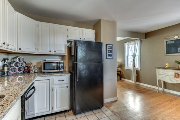 3 1/2 Becket Avenue, Unit 3 Salem, MA 01970 - Photo 5 of 22 a kitchen with stainless steel appliances granite countertop a refrigerator sink and cabinets