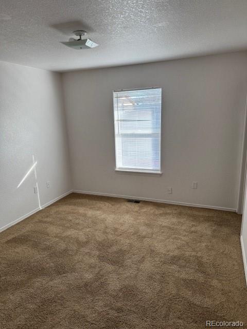 304 Sunset Lane Dacono, CO 80514 - Photo 13 of 22 an empty room with a empty space and windows