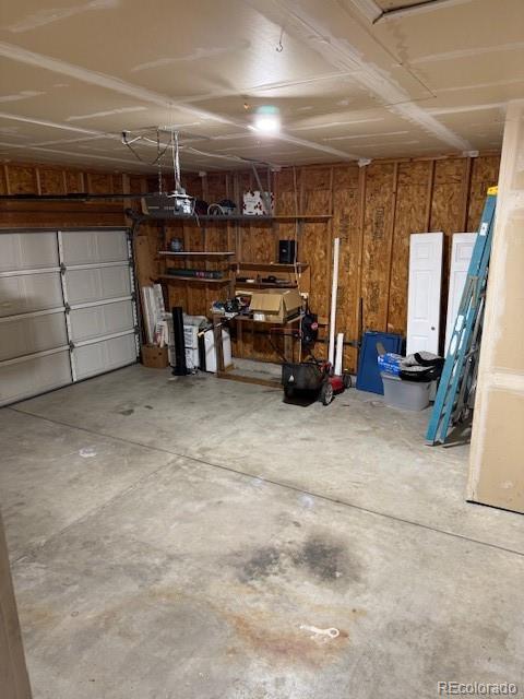 304 Sunset Lane Dacono, CO 80514 - Photo 19 of 22 a view of a garage with storage