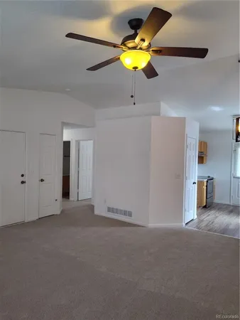 a bathroom with a shower curtain and a toilet