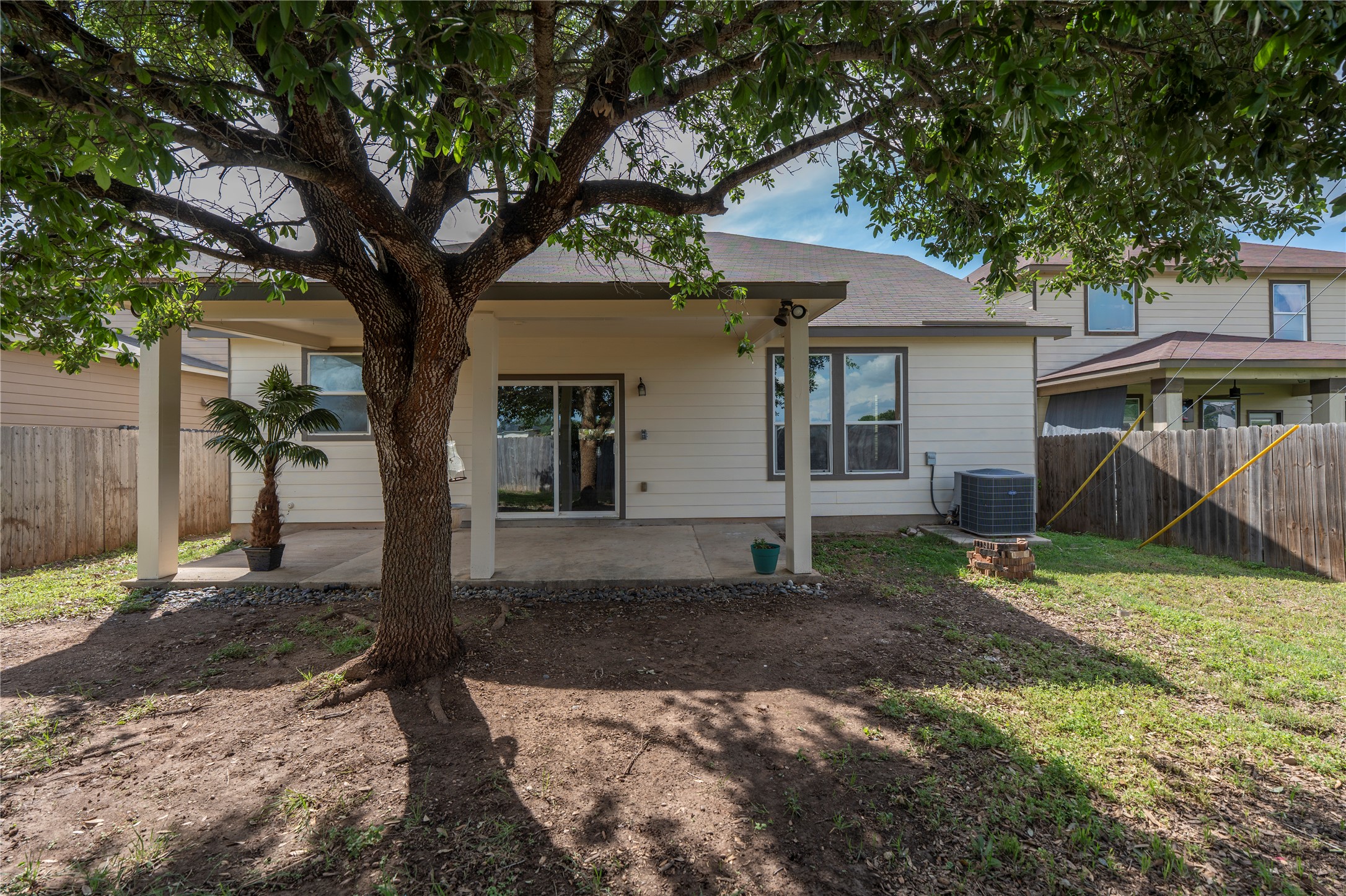 8613 Capitol View Drive Austin, TX 78747 - Photo 28 of 33 A well-shaded patio extends from the home, perfect for outdoor leisure.