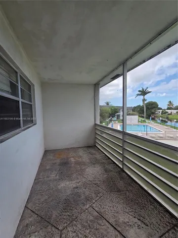 a view of a park with a large trees
