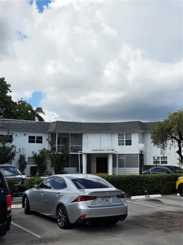 a cars parked in front of a building