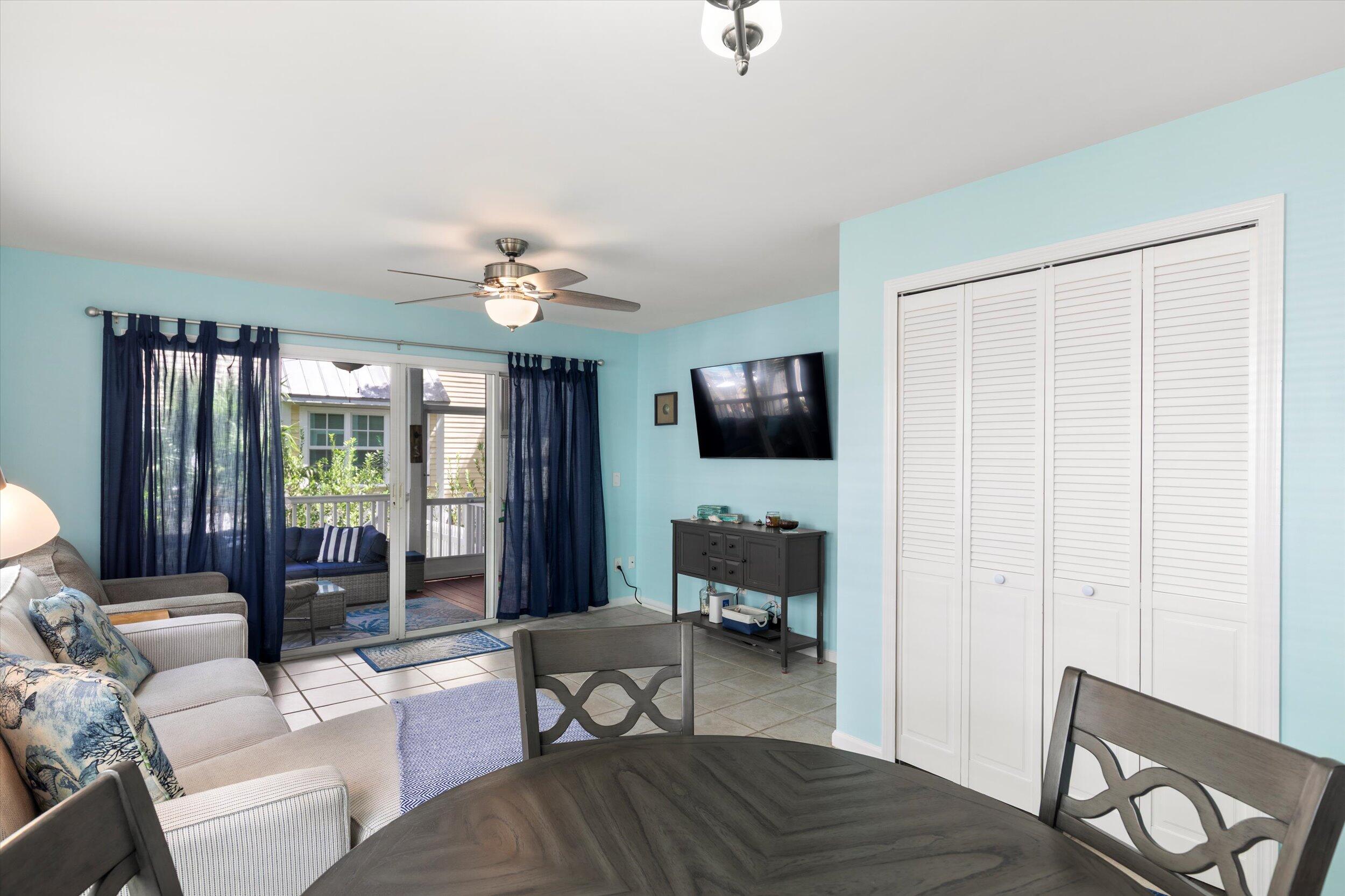 45 Spoonbill Way Key West, FL 33040 - Photo 13 of 80 a living room with furniture a flat screen tv and a large window
