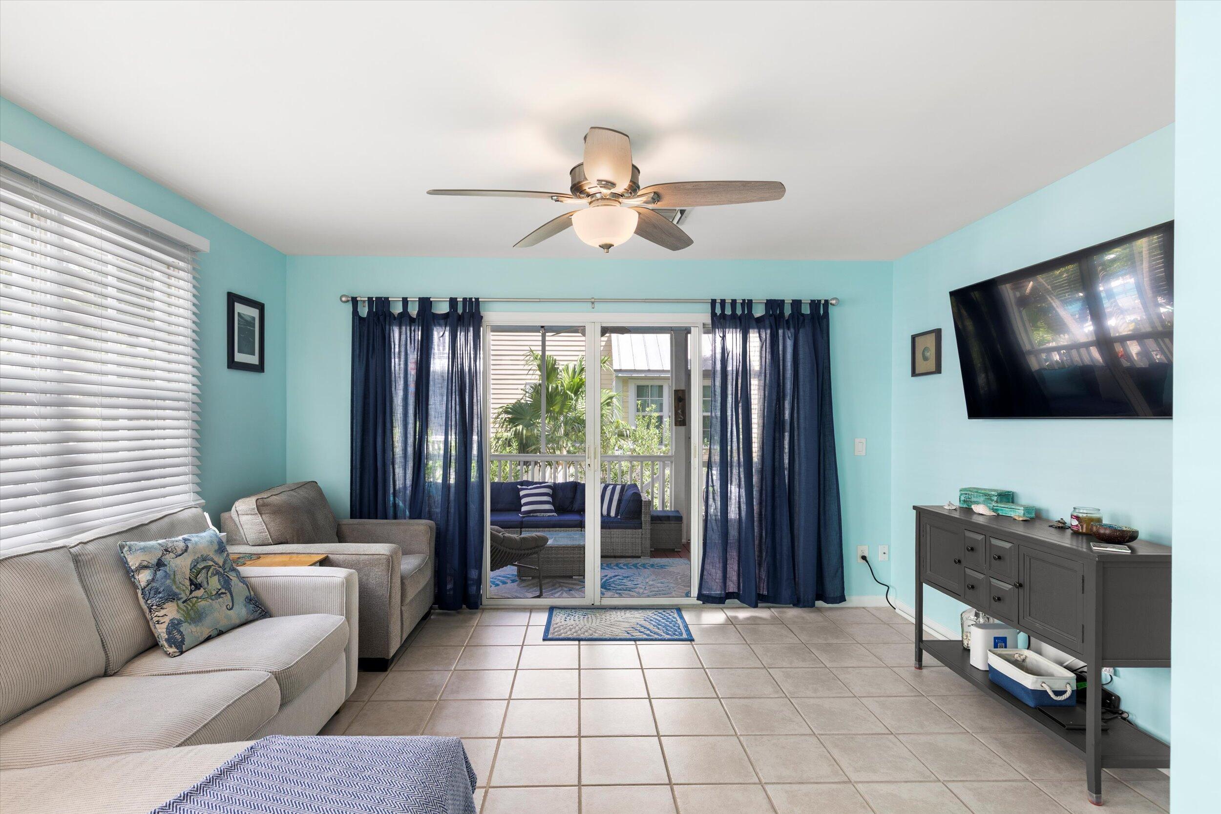 45 Spoonbill Way Key West, FL 33040 - Photo 14 of 80 a living room with furniture and a flat screen tv