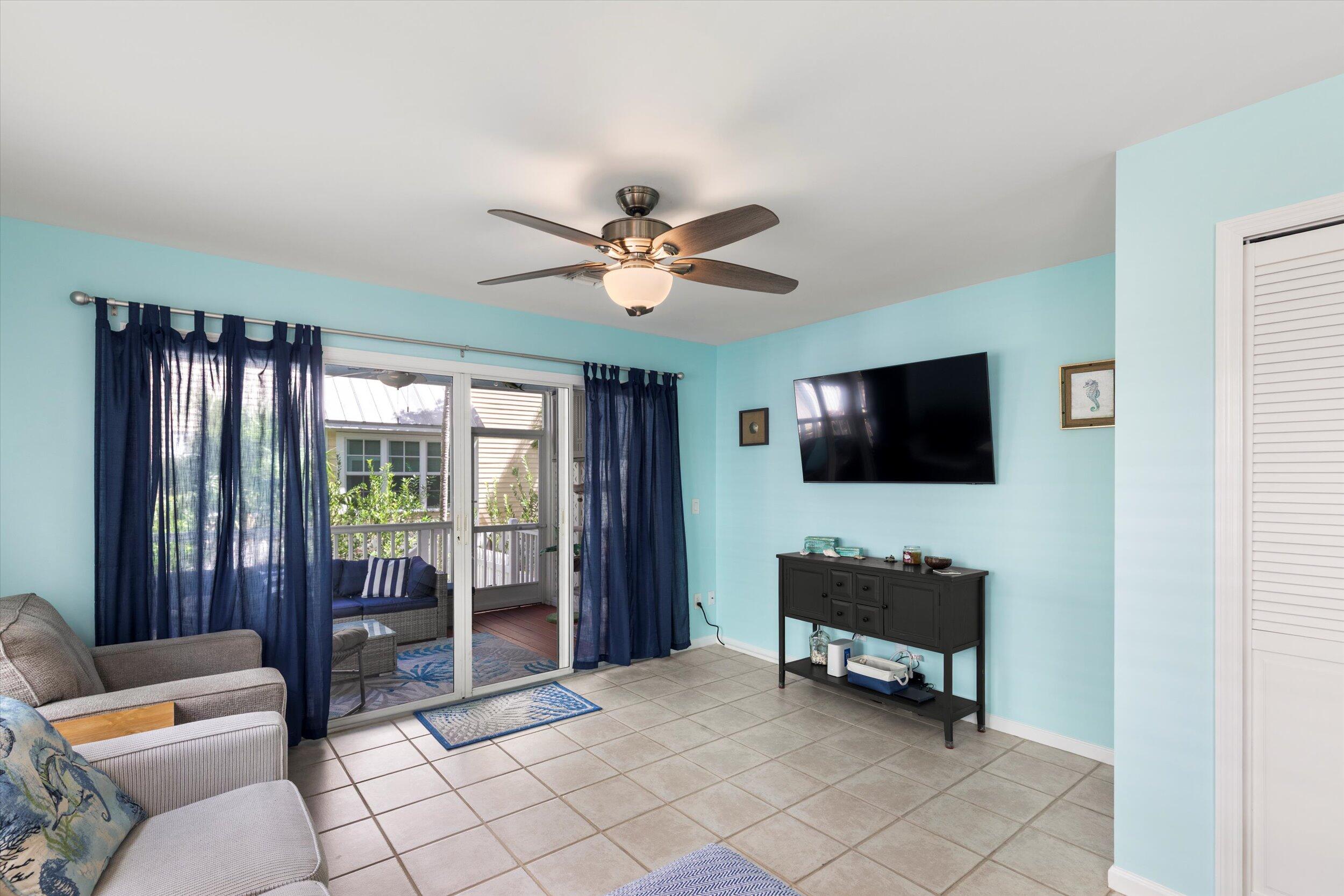 45 Spoonbill Way Key West, FL 33040 - Photo 19 of 80 a living room with furniture and a flat screen tv