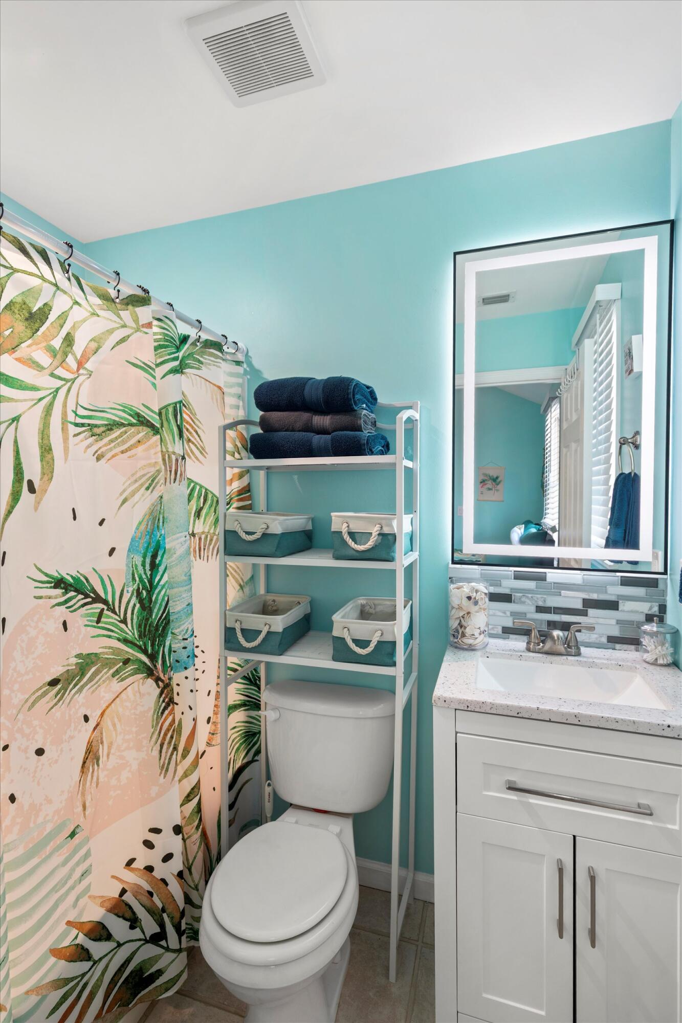 45 Spoonbill Way Key West, FL 33040 - Photo 35 of 80 a bathroom with a sink a toilet a mirror and shower