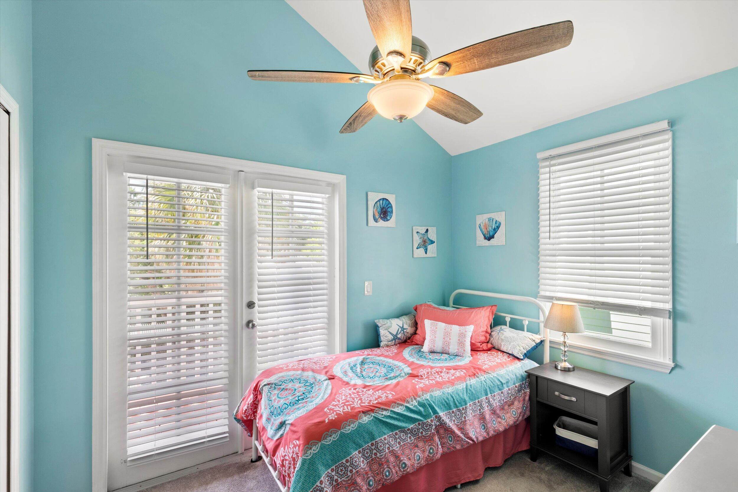 45 Spoonbill Way Key West, FL 33040 - Photo 36 of 80 a bedroom with a bed and a chandelier