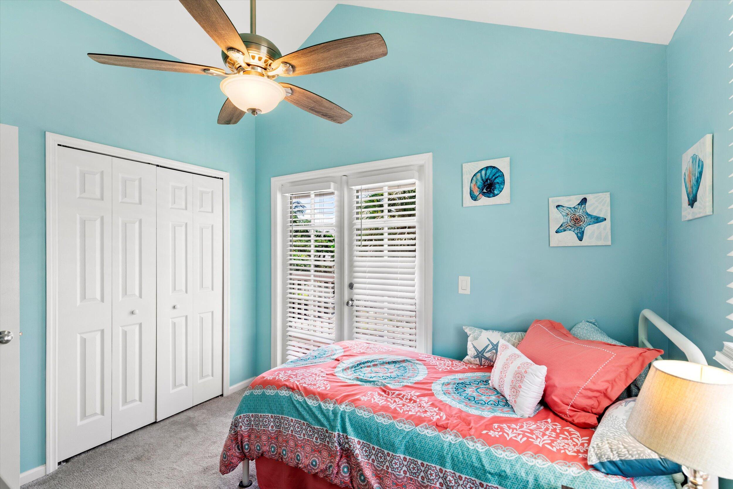 45 Spoonbill Way Key West, FL 33040 - Photo 37 of 80 a bedroom with a bed and a chandelier