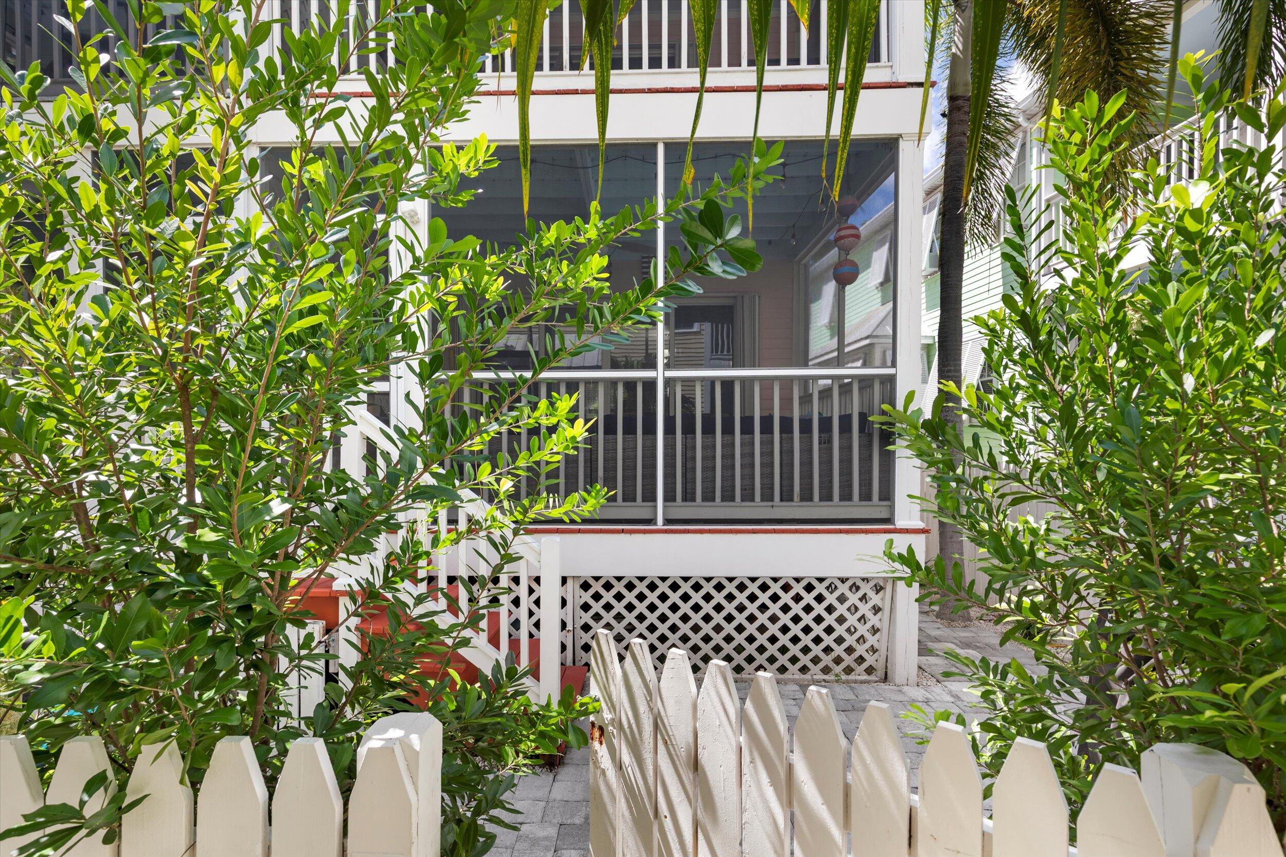 45 Spoonbill Way Key West, FL 33040 - Photo 42 of 80 a view of a door of the house with a flower garden