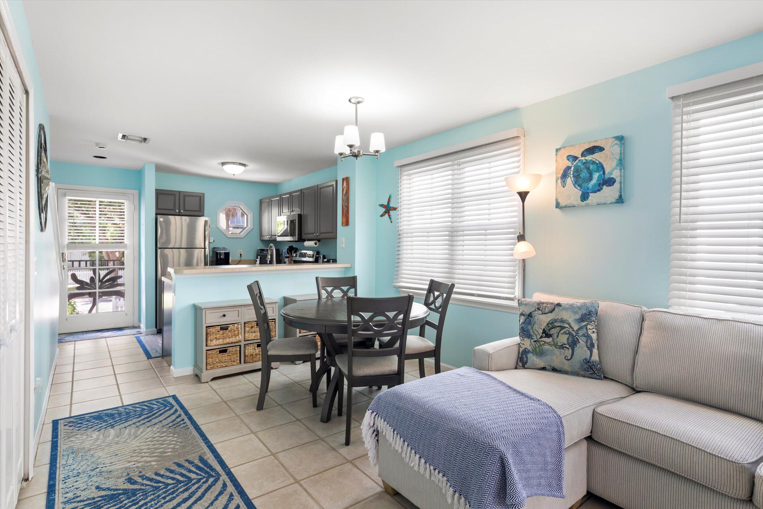 45 Spoonbill Way Key West, FL 33040 - Photo 8 of 80 a living room with furniture and a chandelier