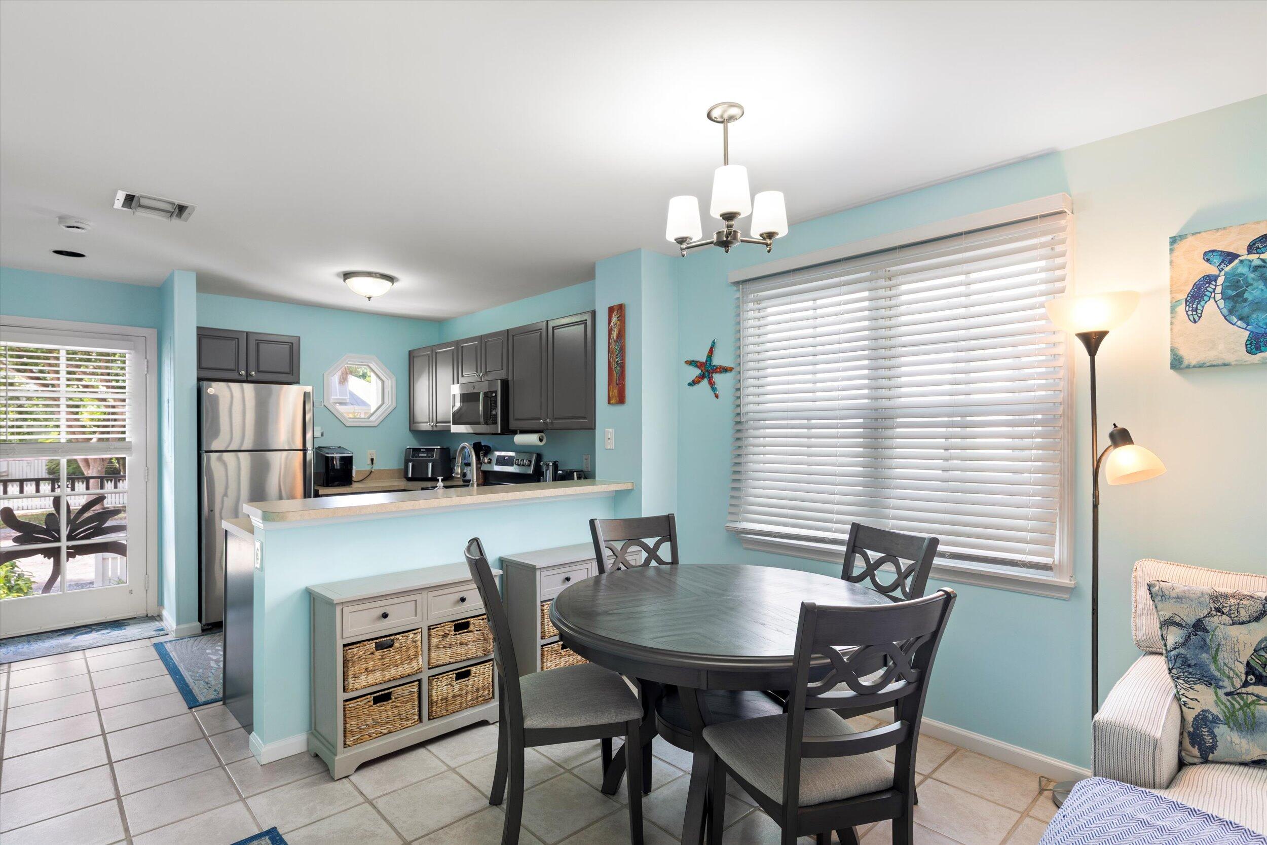 45 Spoonbill Way Key West, FL 33040 - Photo 10 of 80 a view of a dining room with furniture
