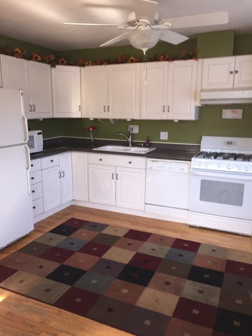 540 Glendale Road Glenview, IL 60025 - Photo 5 of 18 a kitchen with a stove and white cabinets