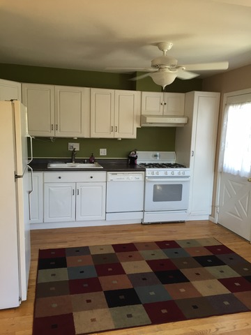 540 Glendale Road Glenview, IL 60025 - Photo 6 of 18 a kitchen with stainless steel appliances a stove a sink and a microwave