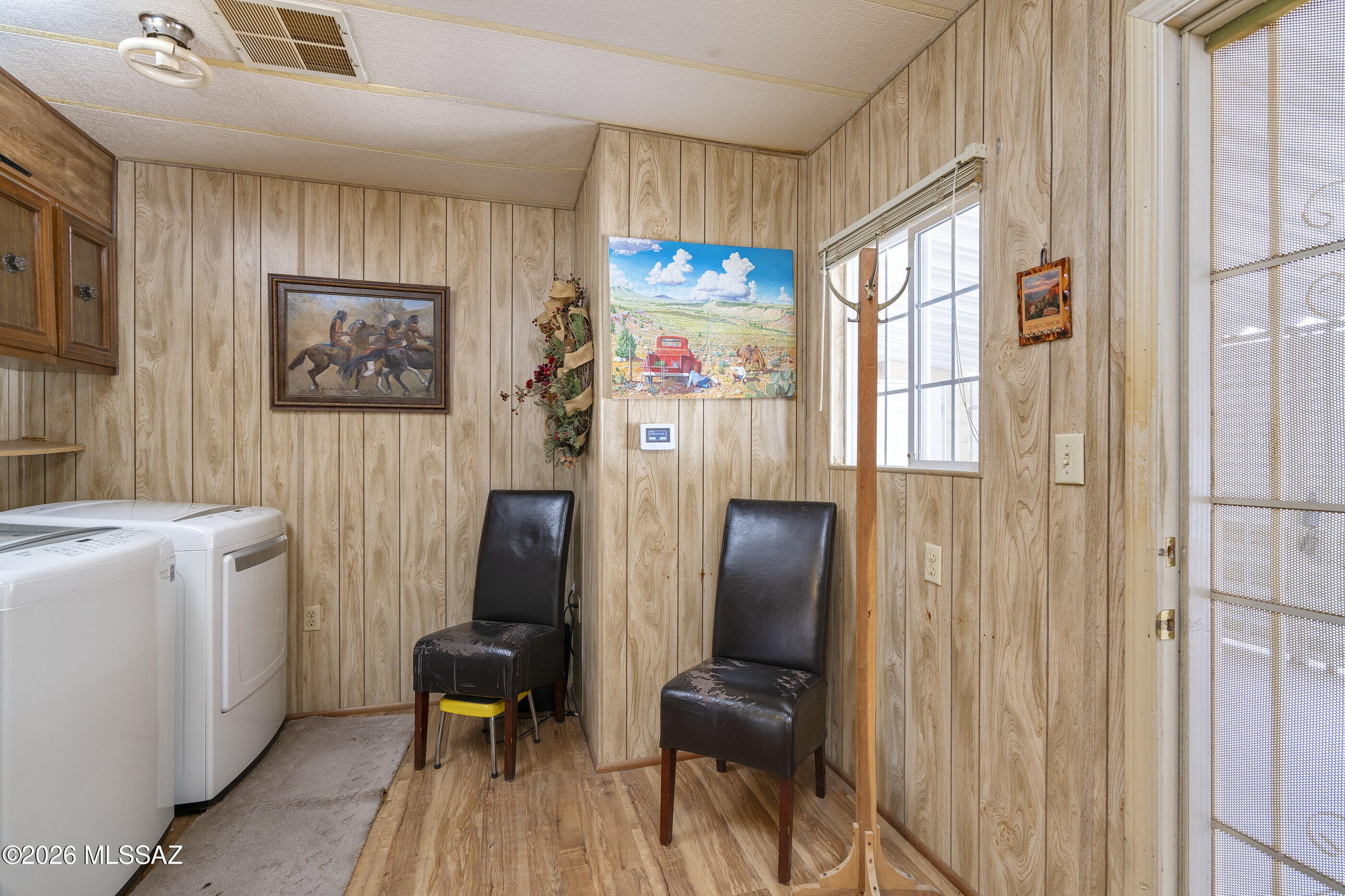 6121 West Flying M Street Tucson, AZ 85713 - Photo 17 of 25 a very nice looking room with many windows and furniture