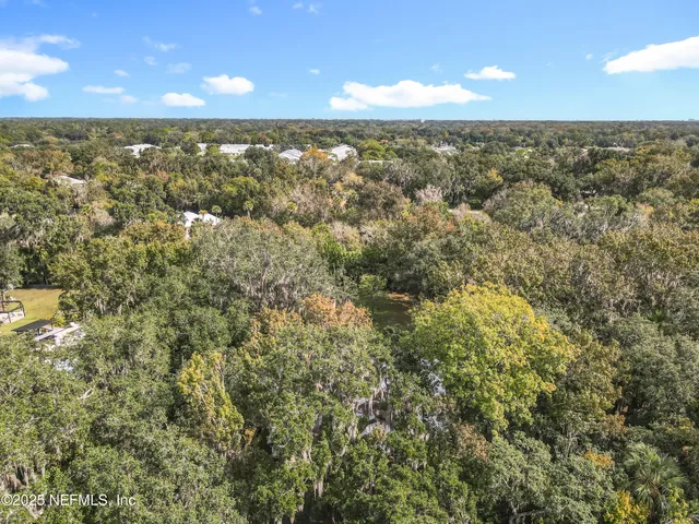 a kitchen with white cabinets stainless steel appliances and sink