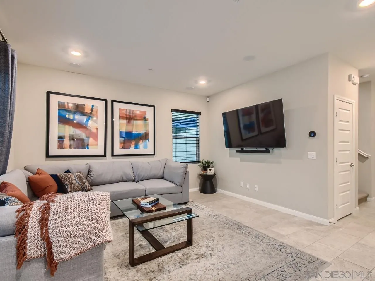 10660 Busch Street Spring Valley, CA 91978 - Photo 11 of 29 a living room with furniture and a flat screen tv