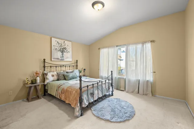 a bedroom with a bed and a cabinets